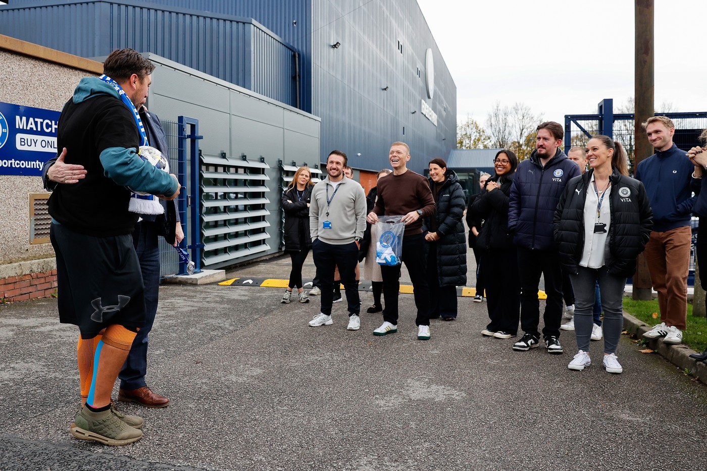 Charity walk arriving at Stockport County